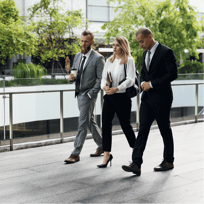 Professionals walking through a modern office